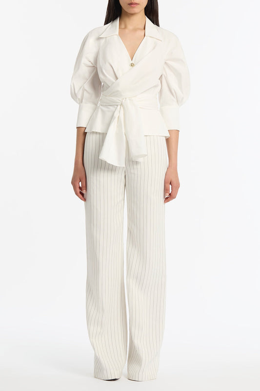 Image of a model wearing Tops. Product name - Ivory Cotton Taffeta Wrap Top in Ivory colour by brand - Carla Zampatti