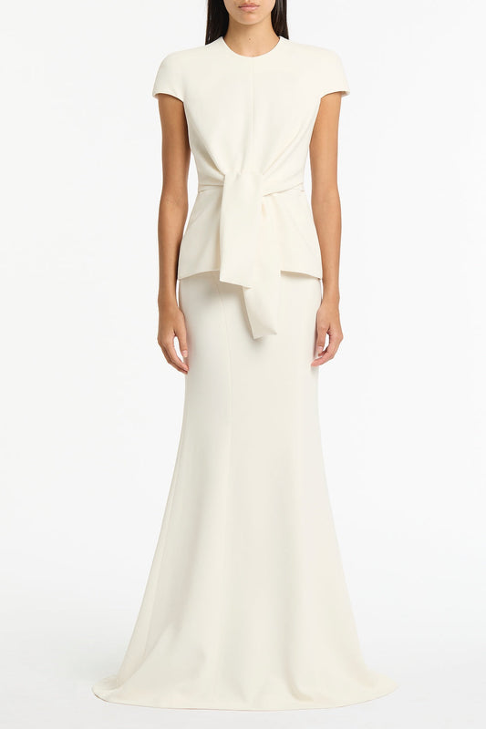 Image of a model wearing Tops. Product name - Ivory Crepe Cap Sleeve Tie Top in Ivory colour by brand - Carla Zampatti