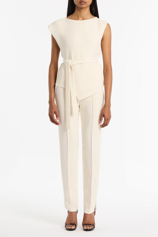Image of a model wearing Tops. Product name - Ivory Crepe Draped Top in White colour by brand - Carla Zampatti