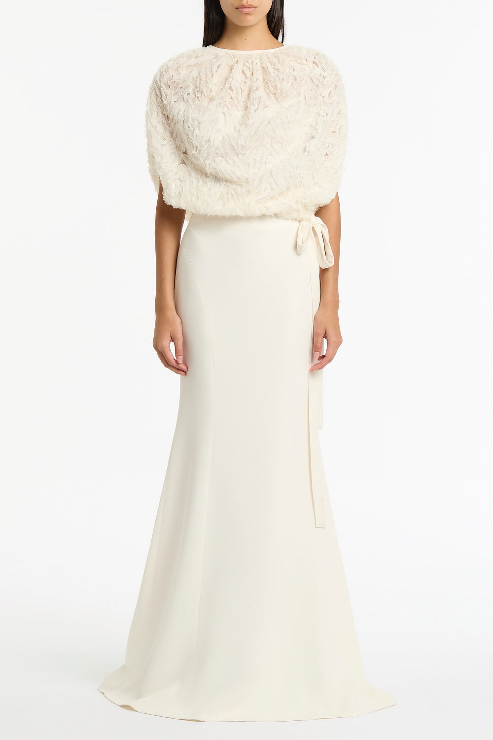 Image of a model wearing Skirts. Product name - Ivory Crepe Fishtail Maxi Skirt in Ivory colour by brand - Carla Zampatti