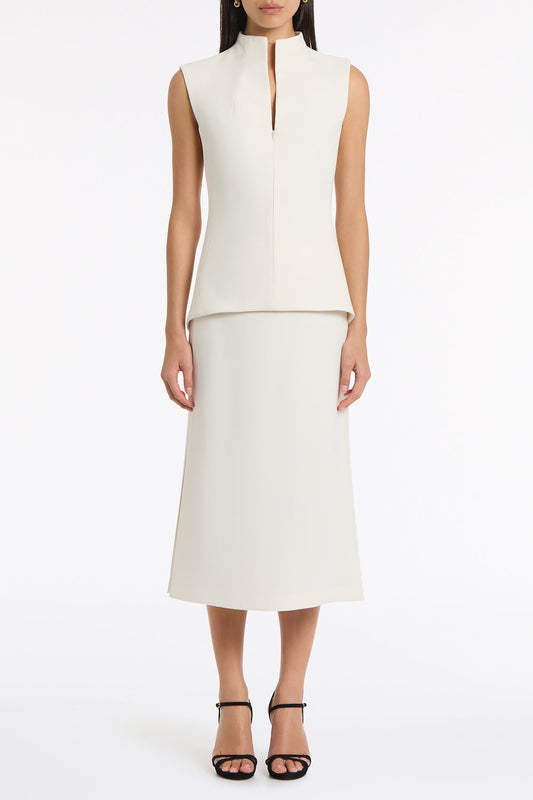Image of a model wearing Tops. Product name - Ivory Crepe High Neck Fitted Bodice in Ivory colour by brand - Carla Zampatti