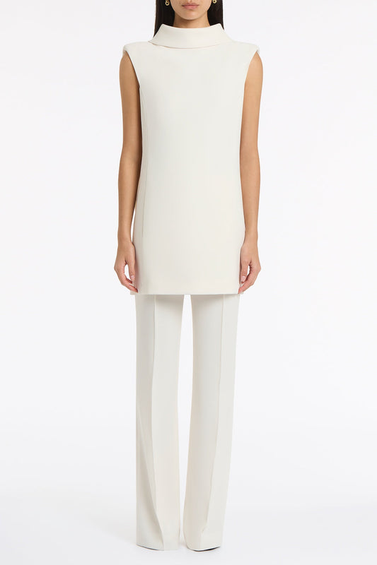 Image of a model wearing Tops. Product name - Ivory Crepe Folded Collar Tunic in Ivory colour by brand - Carla Zampatti