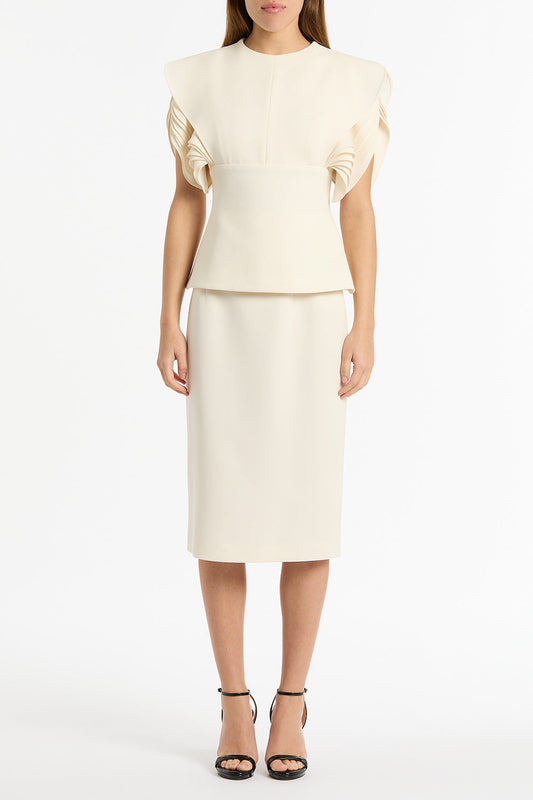 Image of a model wearing Skirts. Product name - Ivory Crepe Pencil Skirt in White colour by brand - Carla Zampatti