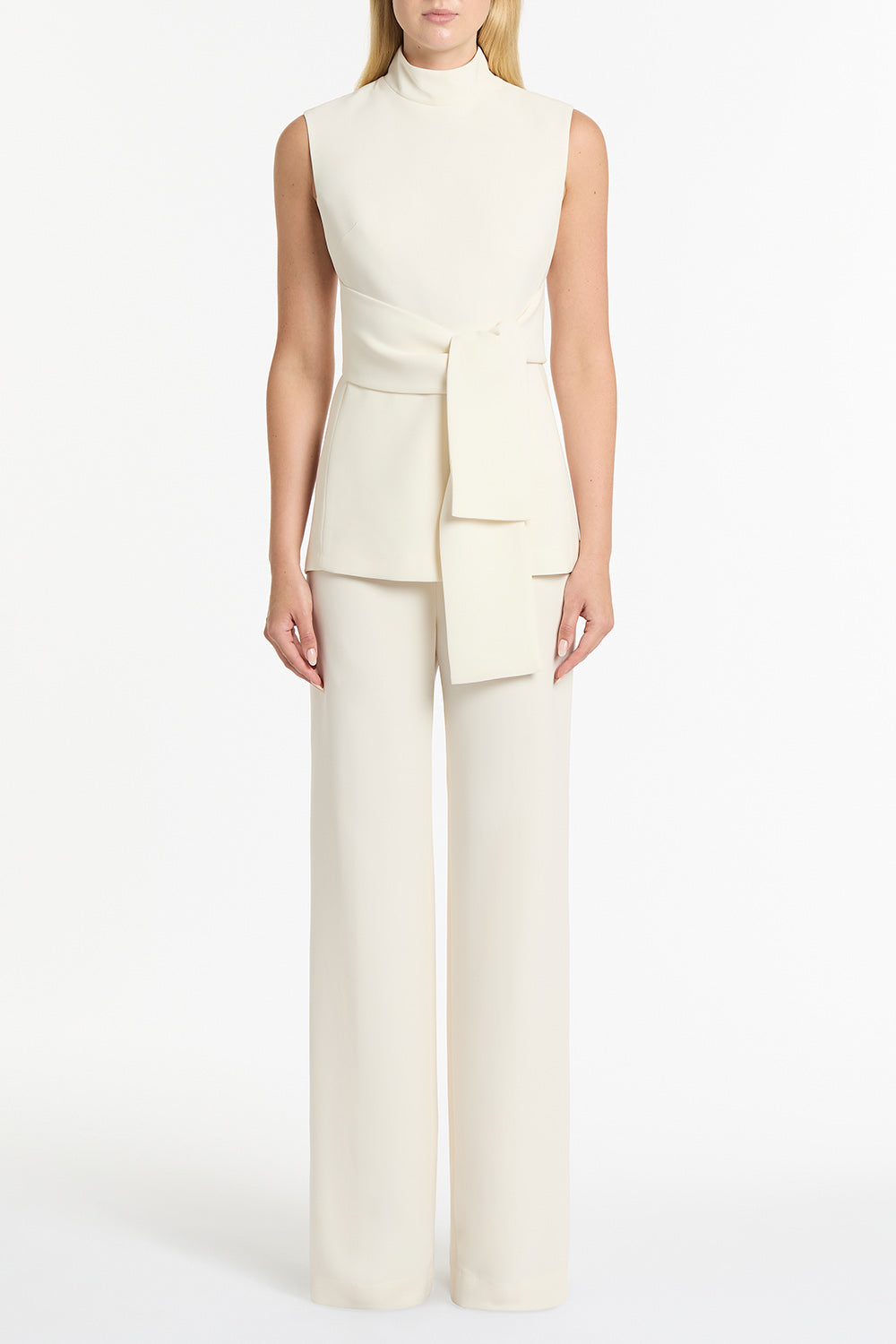 Image of a model wearing Pants. Product name - Ivory Crepe Wide Waisted Pant in Ivory colour by brand - Carla Zampatti