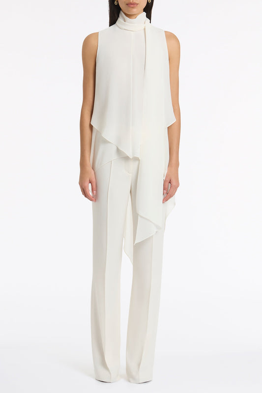 Image of a model wearing Tops. Product name - Ivory Georgette Tie Top in Ivory colour by brand - Carla Zampatti