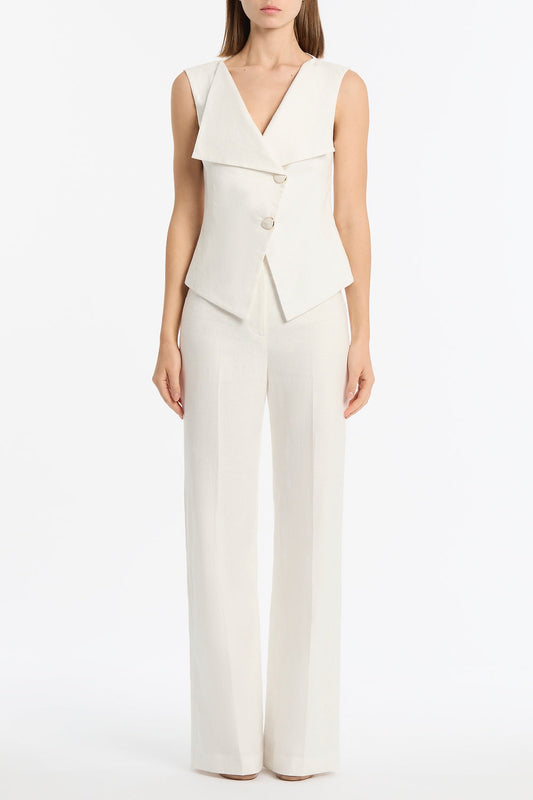 Image of a model wearing Tops. Product name - Ivory Linen Double Breasted Vest in Ivory colour by brand - Carla Zampatti