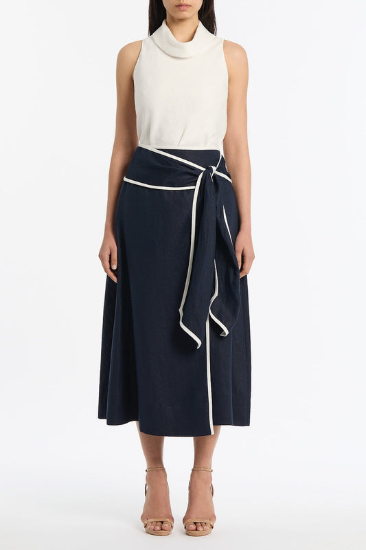Image of a model wearing Tops. Product name - Ivory Linen Folded Collar Top in Ivory colour by brand - Carla Zampatti