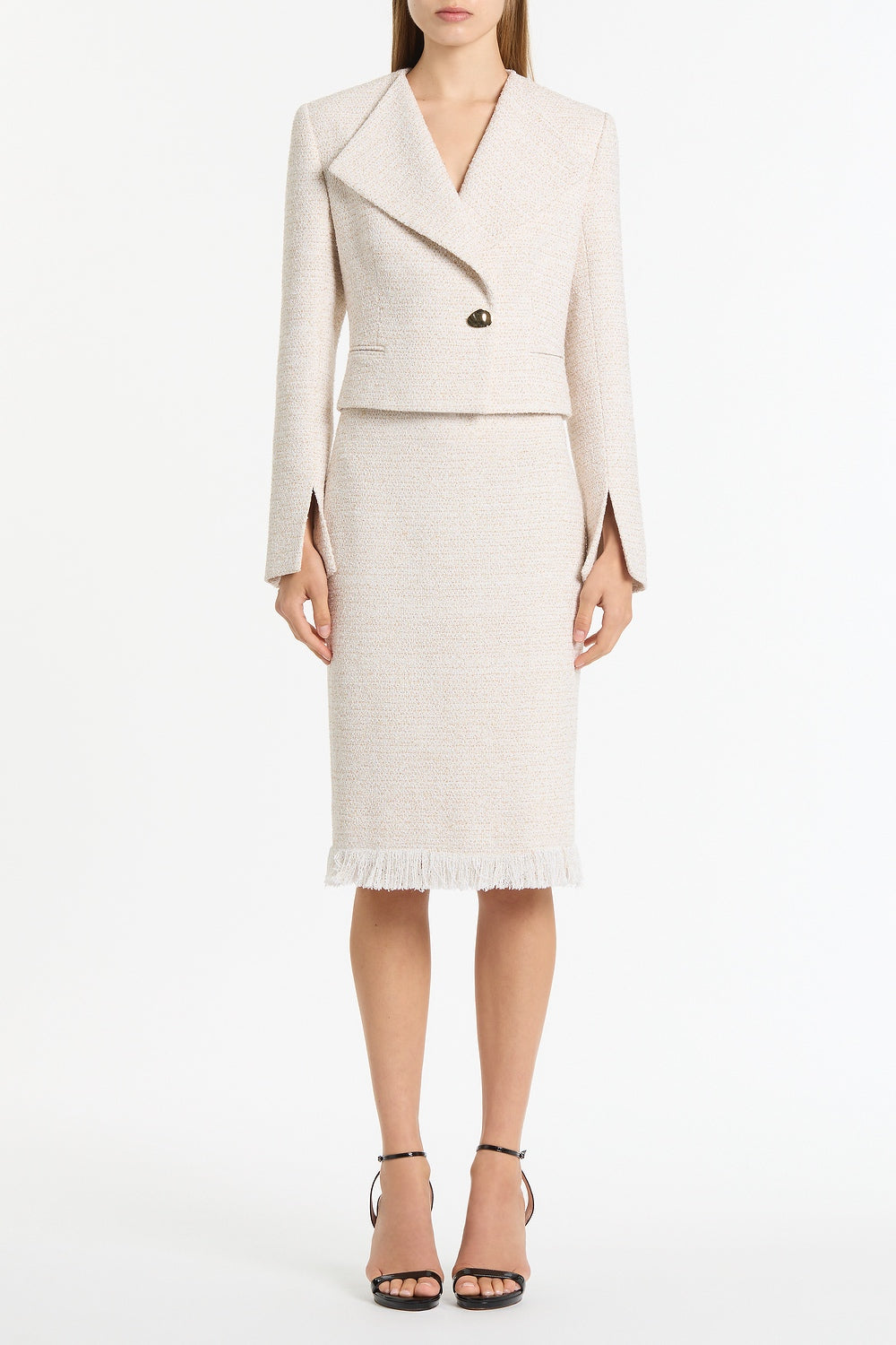 Image of a model wearing Skirts. Product name - Ivory Tweed Fringe Skirt in White colour by brand - Carla Zampatti
