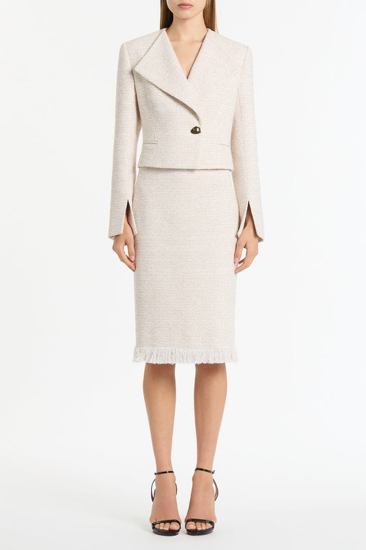 Image of a model wearing Skirts. Product name - Ivory Tweed Fringe Skirt in White colour by brand - Carla Zampatti