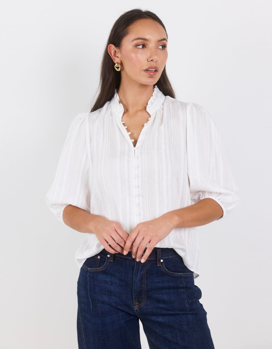 Image of a model wearing Tops. Product name - Continuance Self Stripe Button Through Mid Sleeve Top Ivory in Ivory colour by brand - Ivy & Jack