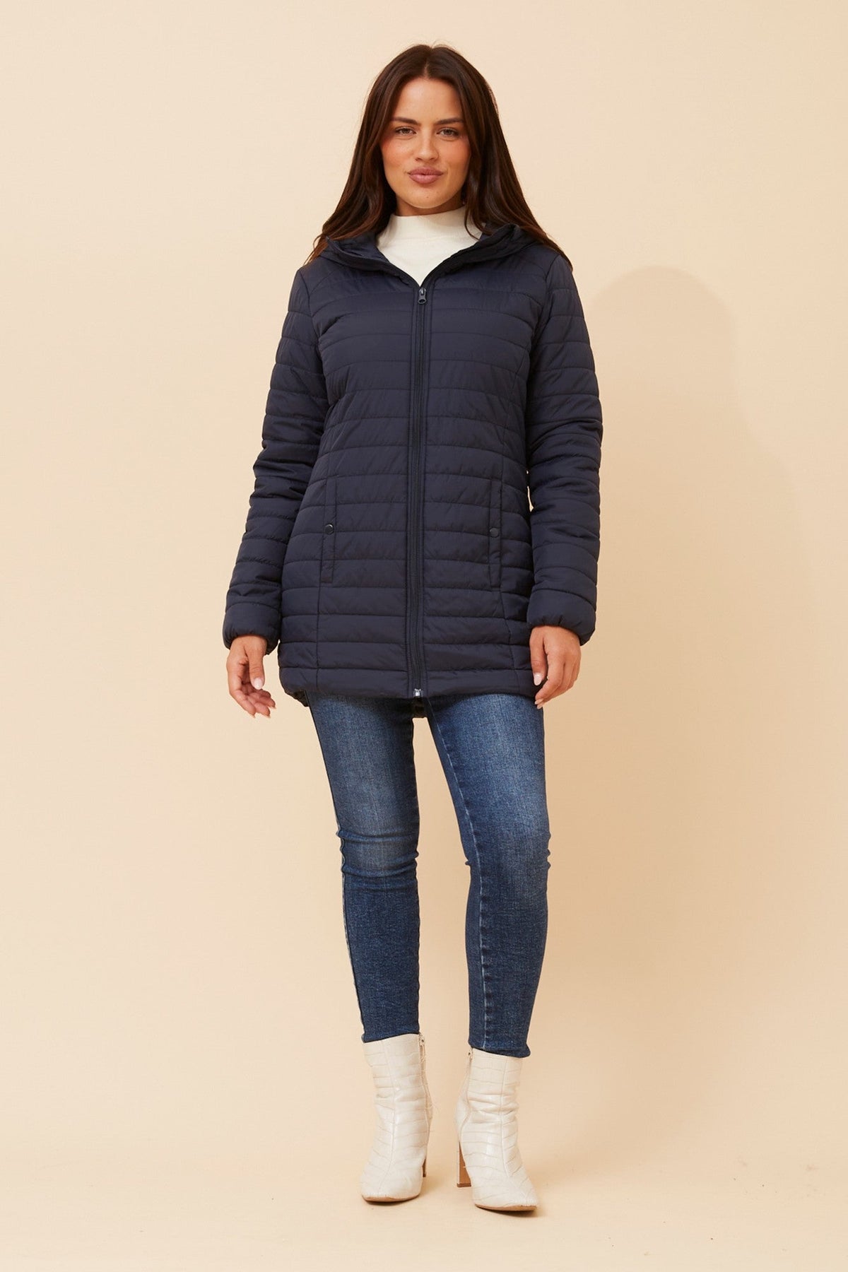 Image of a model wearing Outerwear. Product name - CARSON HOODED PUFFER JACKET in Black colour by brand - Caroline Morgan Australia