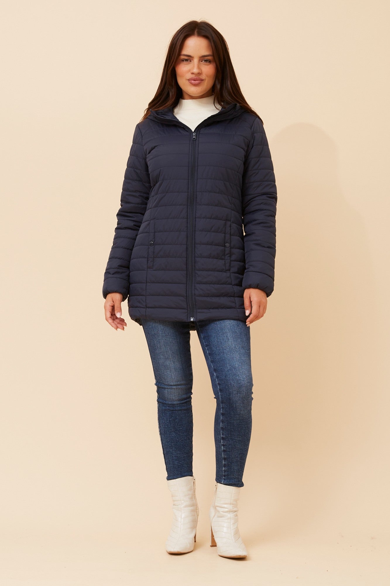 Image of a model wearing Outerwear. Product name - CARSON HOODED PUFFER JACKET in Black colour by brand - Caroline Morgan Australia