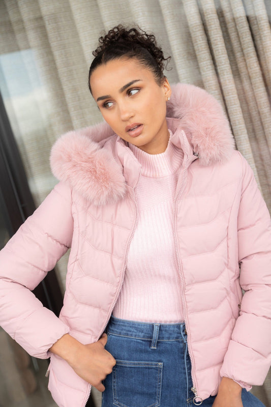 Image of a model wearing Outerwear. Product name - HUA FAUX FUR PUFFER JACKET in Latte colour by brand - Caroline Morgan Australia