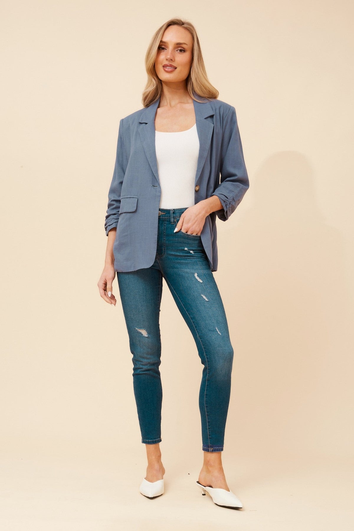 Image of a model wearing Outerwear. Product name - NOVELLA LINEN BLEND BLAZER in Black colour by brand - Caroline Morgan Australia