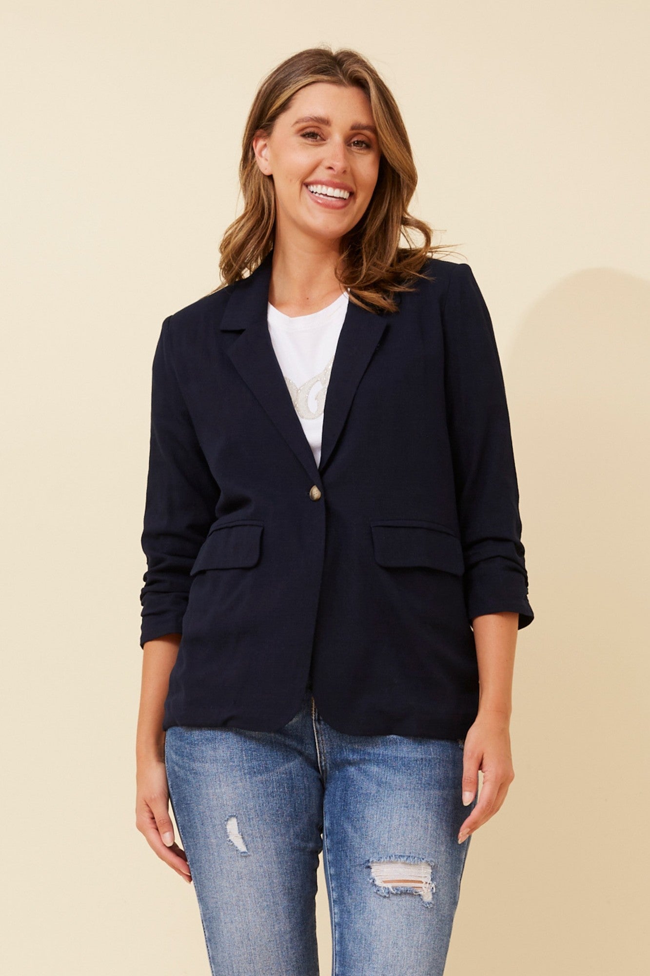 Image of a model wearing Outerwear. Product name - NOVELLA LINEN BLEND BLAZER in Black colour by brand - Caroline Morgan Australia