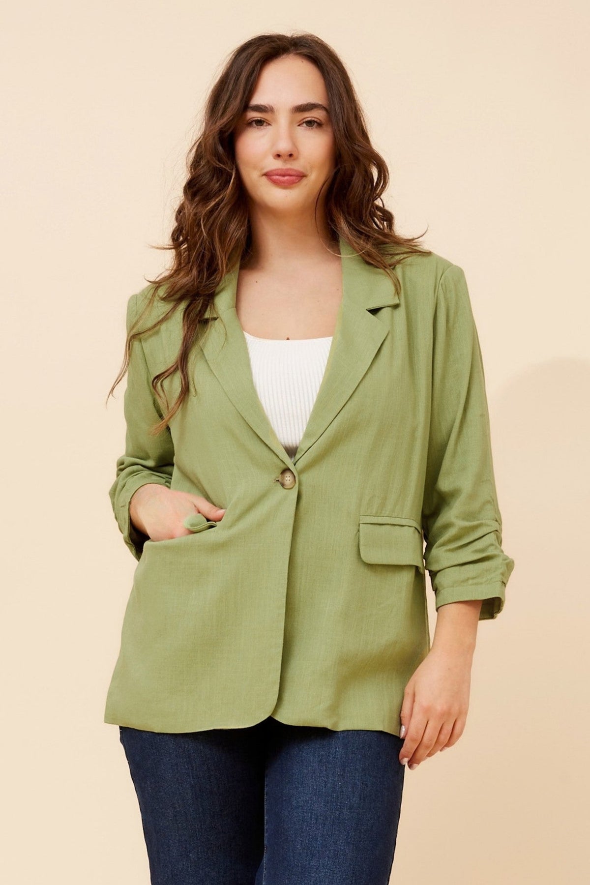 Image of a model wearing Outerwear. Product name - NOVELLA LINEN BLEND BLAZER in Pistachio colour by brand - Caroline Morgan Australia