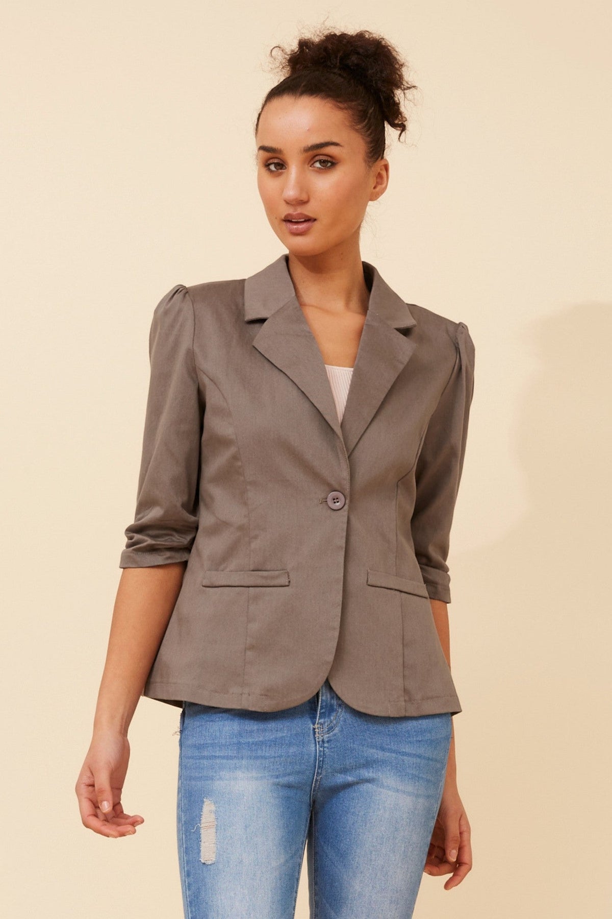 Image of a model wearing Outerwear. Product name - MILOS SOLID BLAZER in Taupe colour by brand - Caroline Morgan Australia
