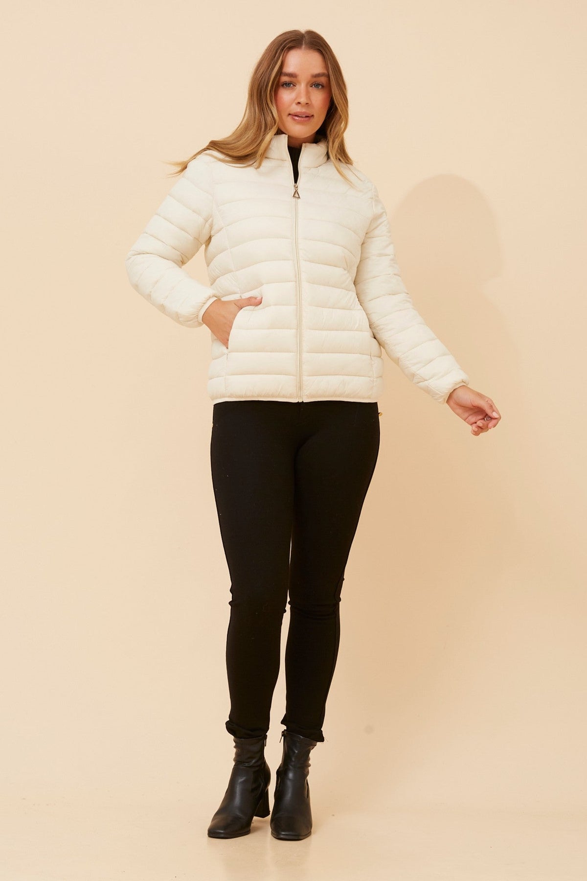 Image of a model wearing Outerwear. Product name - ADAYA SOLID PUFFER JACKET in Black colour by brand - Caroline Morgan Australia