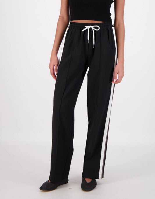 Image of a model wearing Pants. Productname: Cassis Trousers - in Black colour by brand - Jasmine Alexa