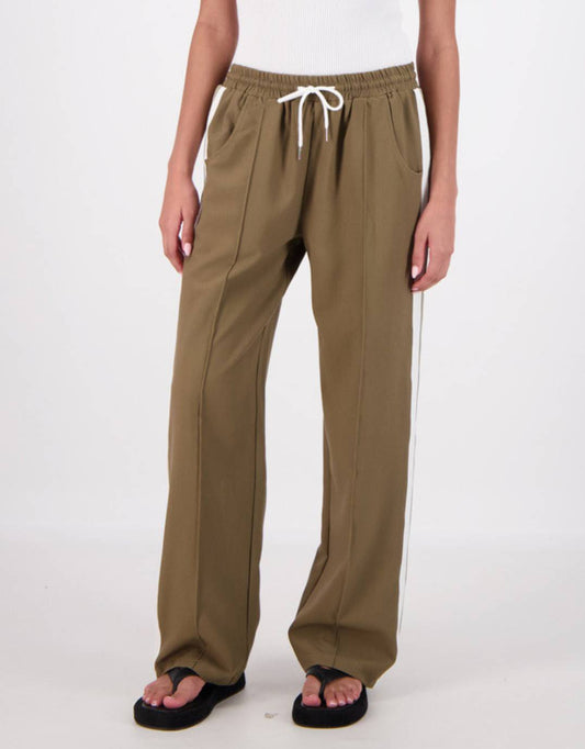 Image of a model wearing Pants. Productname: Cassis Trousers - in Olive colour by brand - Jasmine Alexa