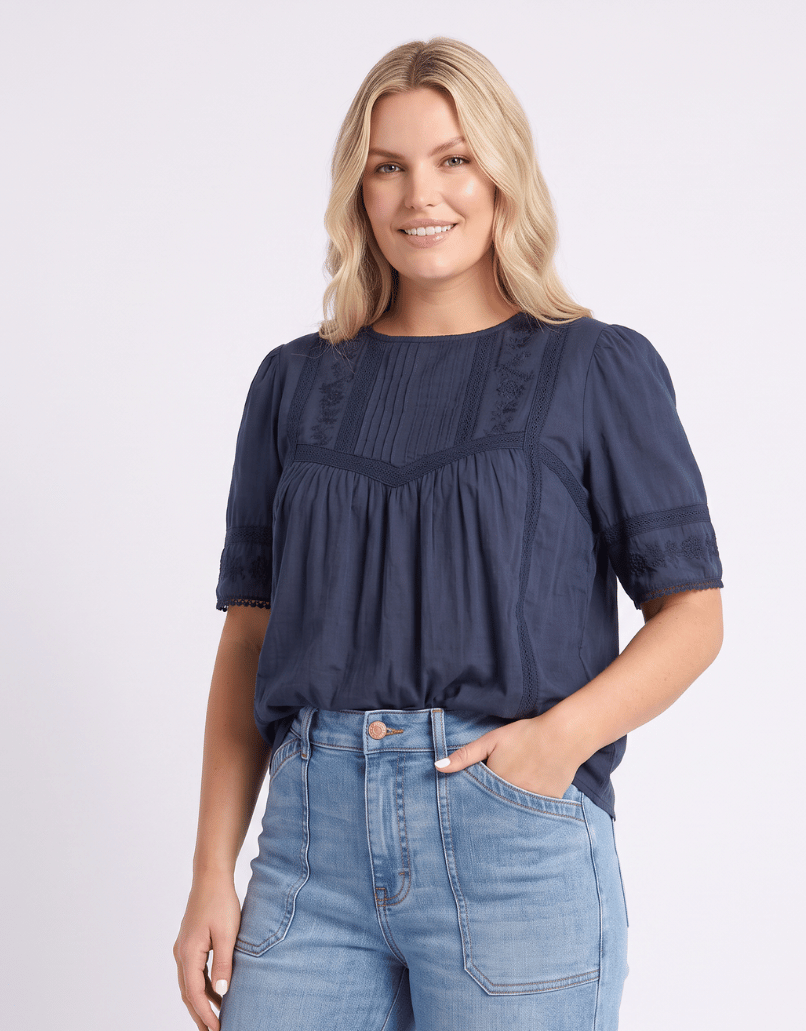 Image of a model wearing Tops. Product name - Juna Top Navy in Navy colour by brand - Foxwood