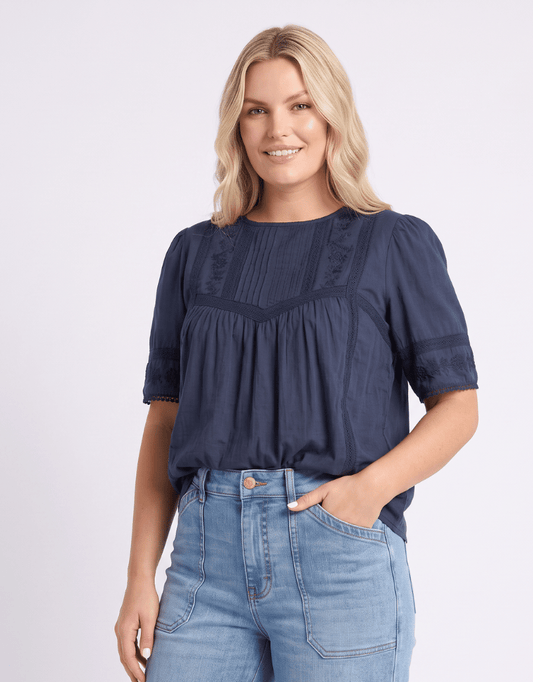 Image of a model wearing Tops. Product name - Juna Top Navy in Navy colour by brand - Foxwood