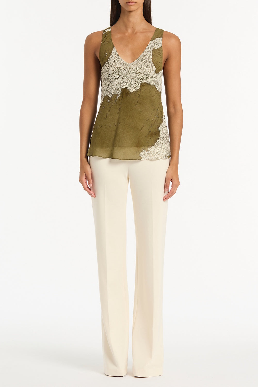 Image of a model wearing Tops. Product name - Juniper Italia Georgette Scoop Cami in Green colour by brand - Carla Zampatti