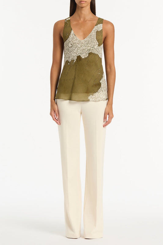 Image of a model wearing Tops. Product name - Juniper Italia Georgette Scoop Cami in Green colour by brand - Carla Zampatti