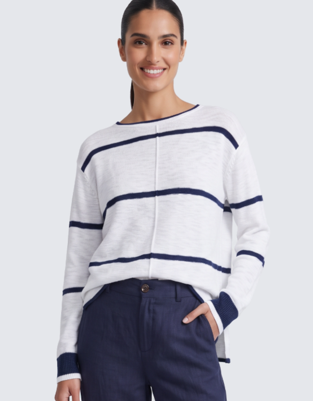 Image of a model wearing Tops. Product name - Kaia Knit Top White/Navy Stripe in White/Navy Stripe colour by brand - Little Lies