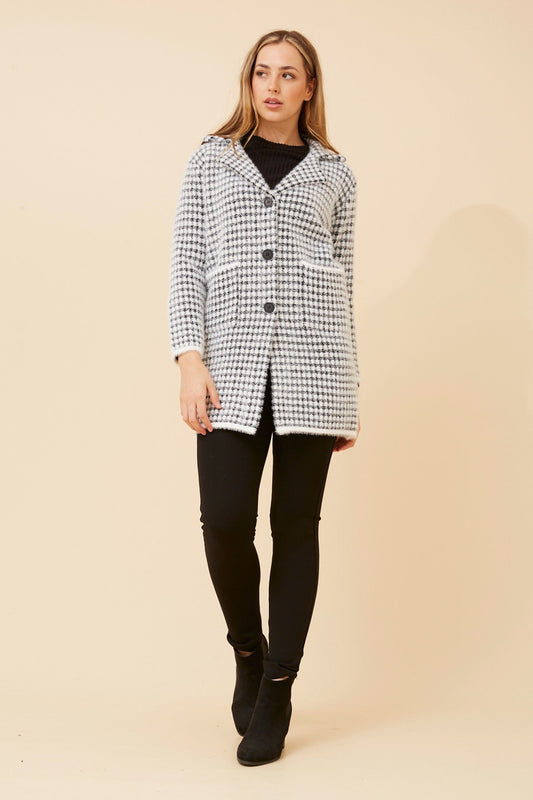 Image of a model wearing Tops. Product name - BRAD HOUNDSTOOTH PRINT KNIT COATIGAN in White colour by brand - Caroline Morgan Australia