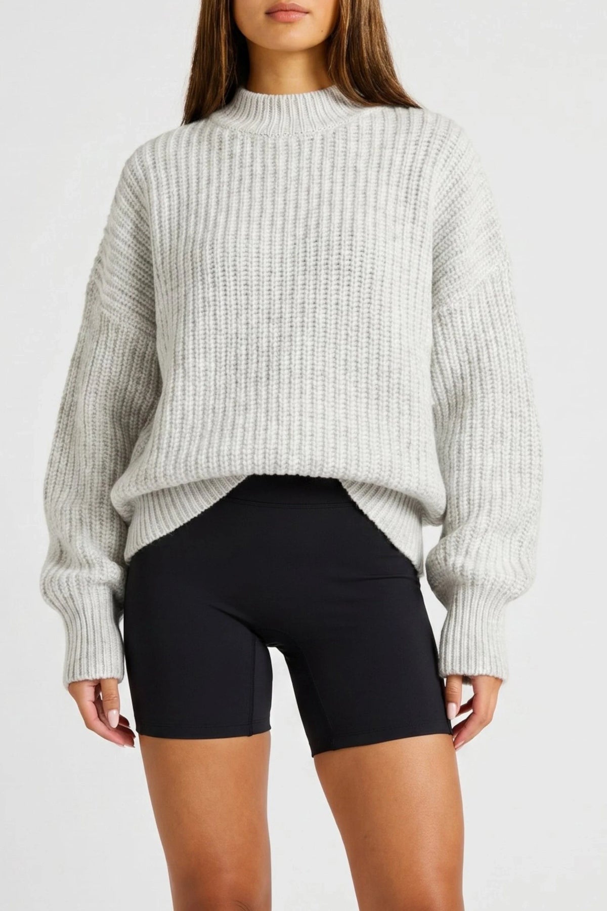 Image of a model wearing Outerwear. Product name - Funnel Neck Knit in Grey colour by brand - All Fenix