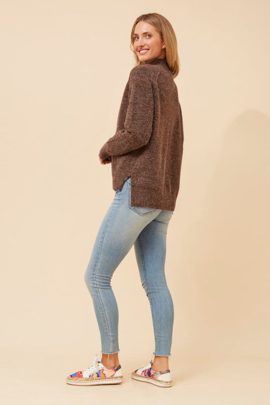 Image of a model wearing Outerwear. Product name - GRETCHEN SOLID KNIT JUMPER in Jade colour by brand - Caroline Morgan Australia