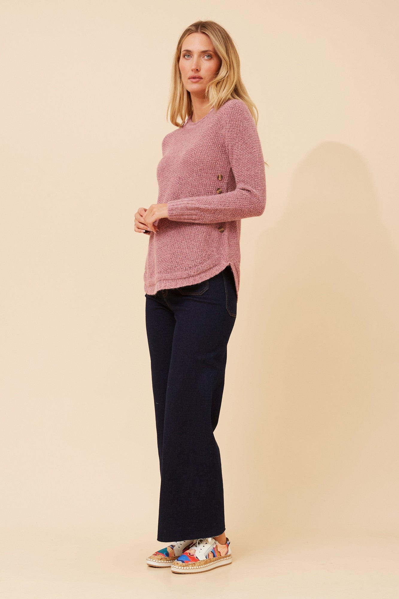 Image of a model wearing Outerwear. Product name - HILLARY SOLID KNIT PULLOVER in Real Black colour by brand - Caroline Morgan Australia