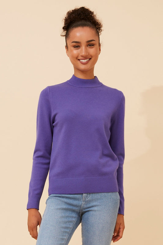 Image of a model wearing Tops. Product name - PETUNIA TURTLE NECK KNIT PULLOVER in Purple colour by brand - Caroline Morgan Australia