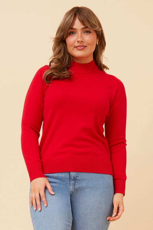 Image of a model wearing Tops. Product name - PETUNIA TURTLE NECK KNIT PULLOVER in Red colour by brand - Caroline Morgan Australia