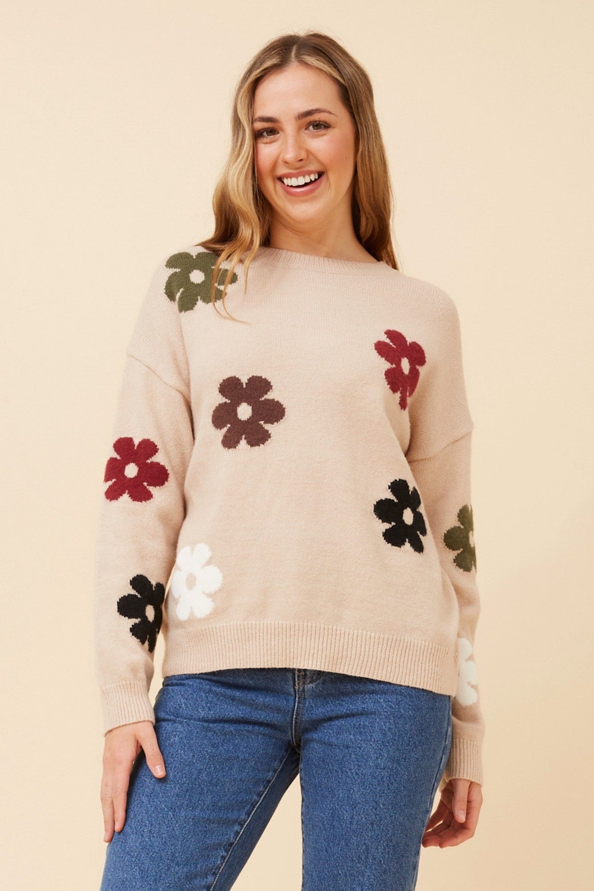 Image of a model wearing Outerwear. Product name - ASTER FLORAL KNIT PULLOVER in Oatmeal colour by brand - Caroline Morgan Australia