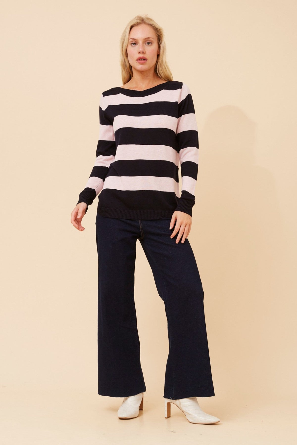 Image of a model wearing Outerwear. Product name - RAMIA STRIPE KNIT PULLOVER in Navy colour by brand - Caroline Morgan Australia