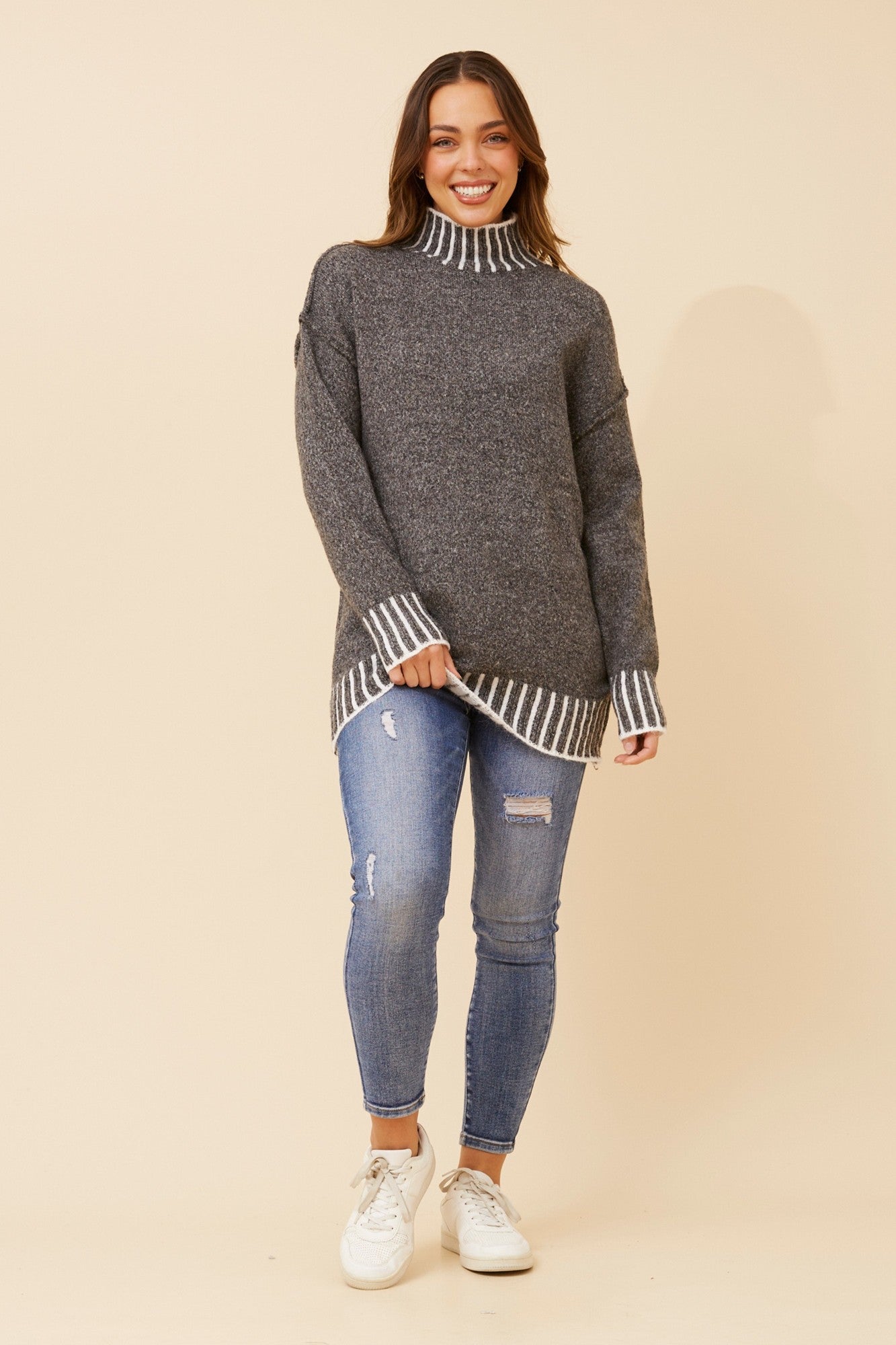 Image of a model wearing Outerwear. Product name - CAS BLANKET STITCH PULLOVER in Black colour by brand - Caroline Morgan Australia