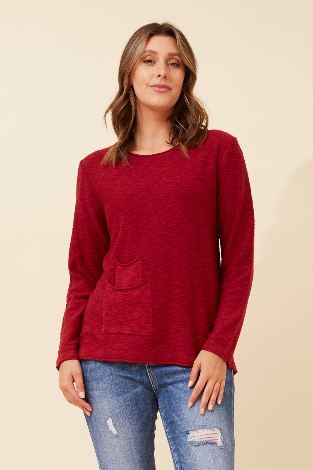 Image of a model wearing Outerwear. Product name - ARAMINTA SOLID PULLOVER in Azalea Pink colour by brand - Caroline Morgan Australia