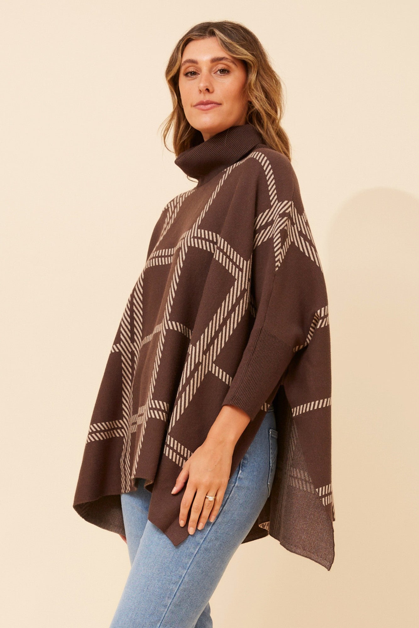 Image of a model wearing Outerwear. Product name - ONYX CHECK KNIT PULLOVER in Chocolate colour by brand - Caroline Morgan Australia