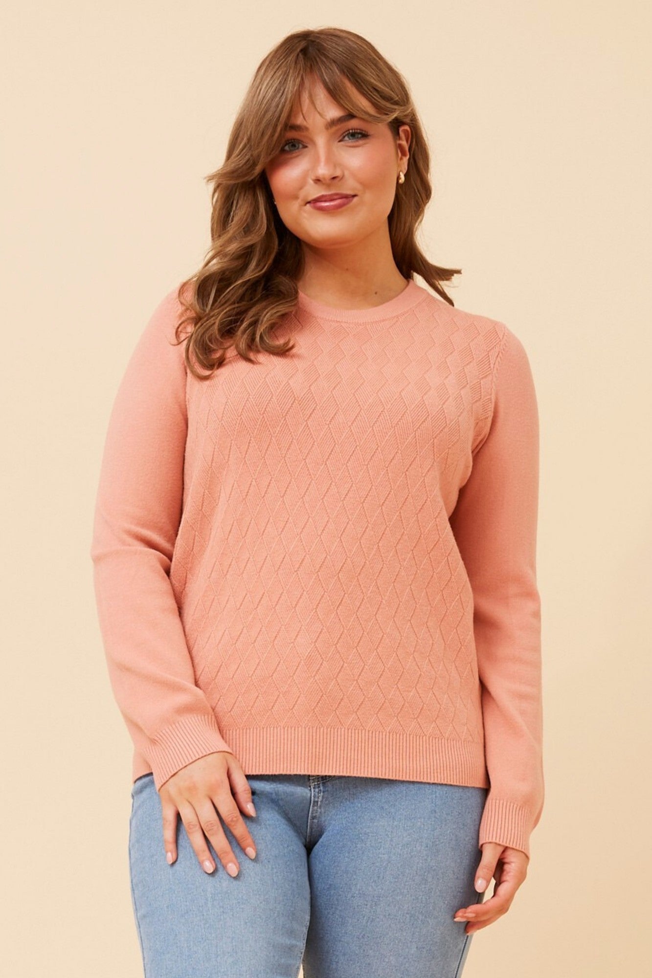 Image of a model wearing Outerwear. Product name - ANGIE KNIT PULLOVER in Black colour by brand - Caroline Morgan Australia