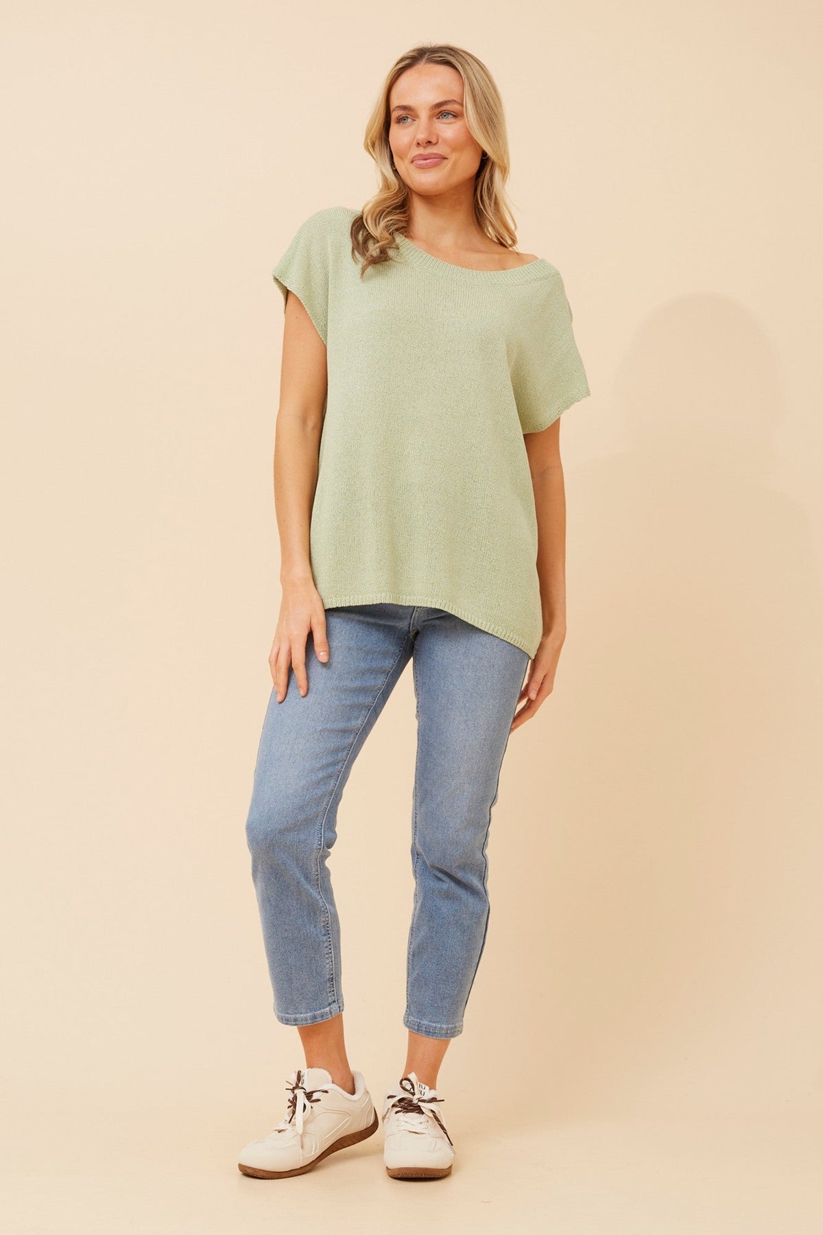 Image of a model wearing Tops. Product name - JOBETH SOLID KNIT TOP in Black colour by brand - Caroline Morgan Australia