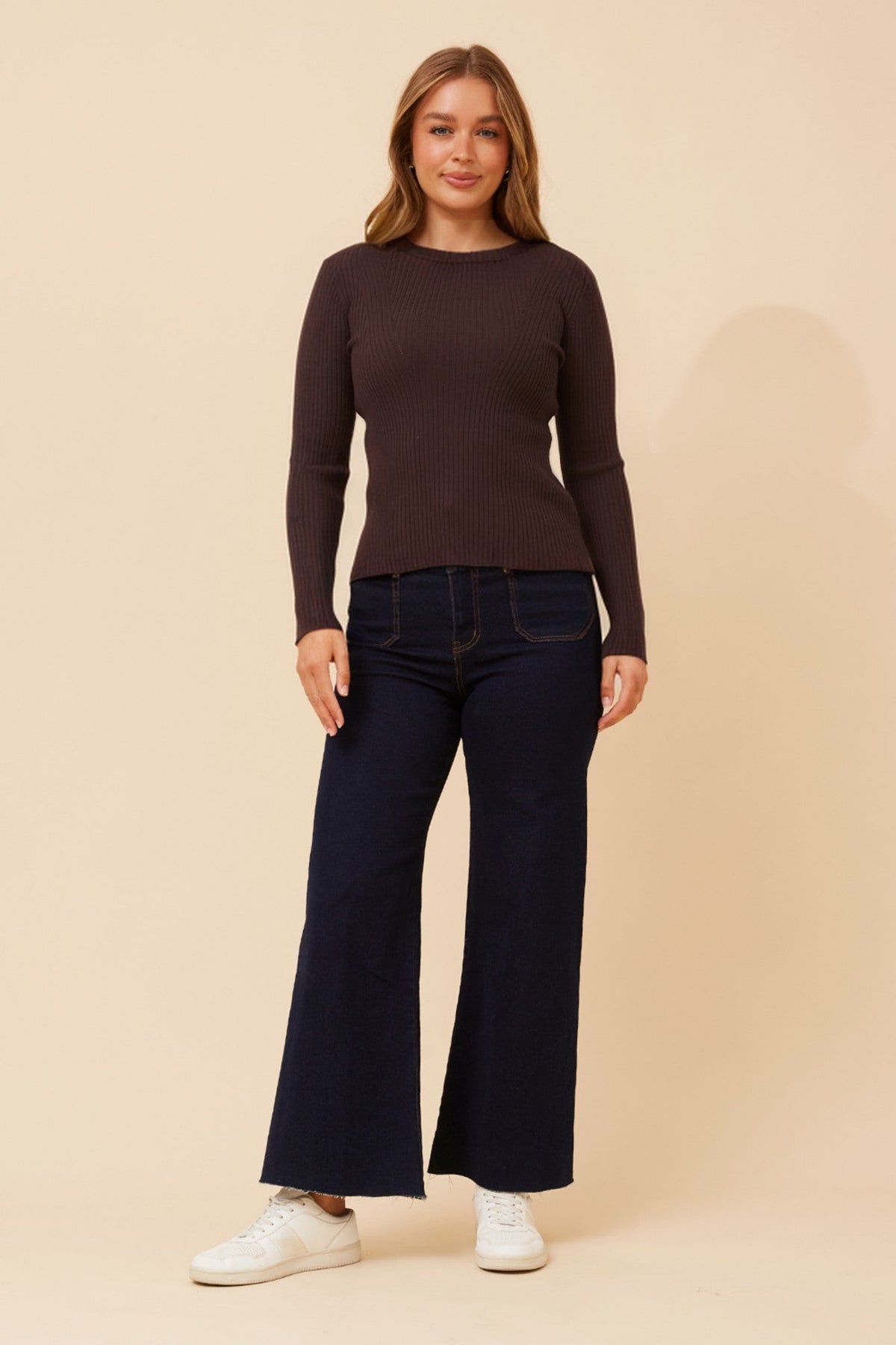Image of a model wearing Outerwear. Product name - CARLETTA SOLID KNIT PULLOVER in Chocolate colour by brand - Caroline Morgan Australia