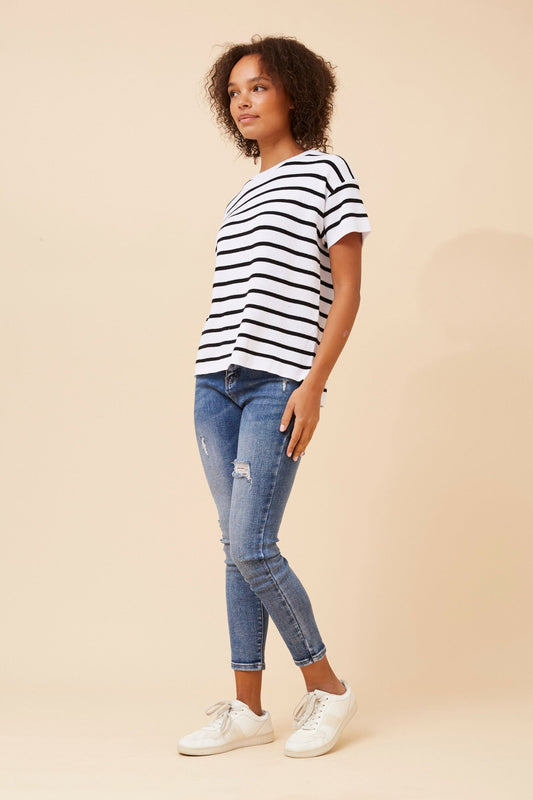 Image of a model wearing Tops. Product name - DOVA STRIPE PATTERN KNIT TOP in White And Black colour by brand - Caroline Morgan Australia