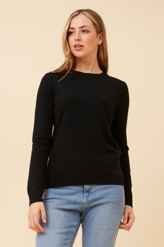Image of a model wearing Outerwear. Product name - ANGIE SOLID KNIT PULLOVER in Black colour by brand - Caroline Morgan Australia