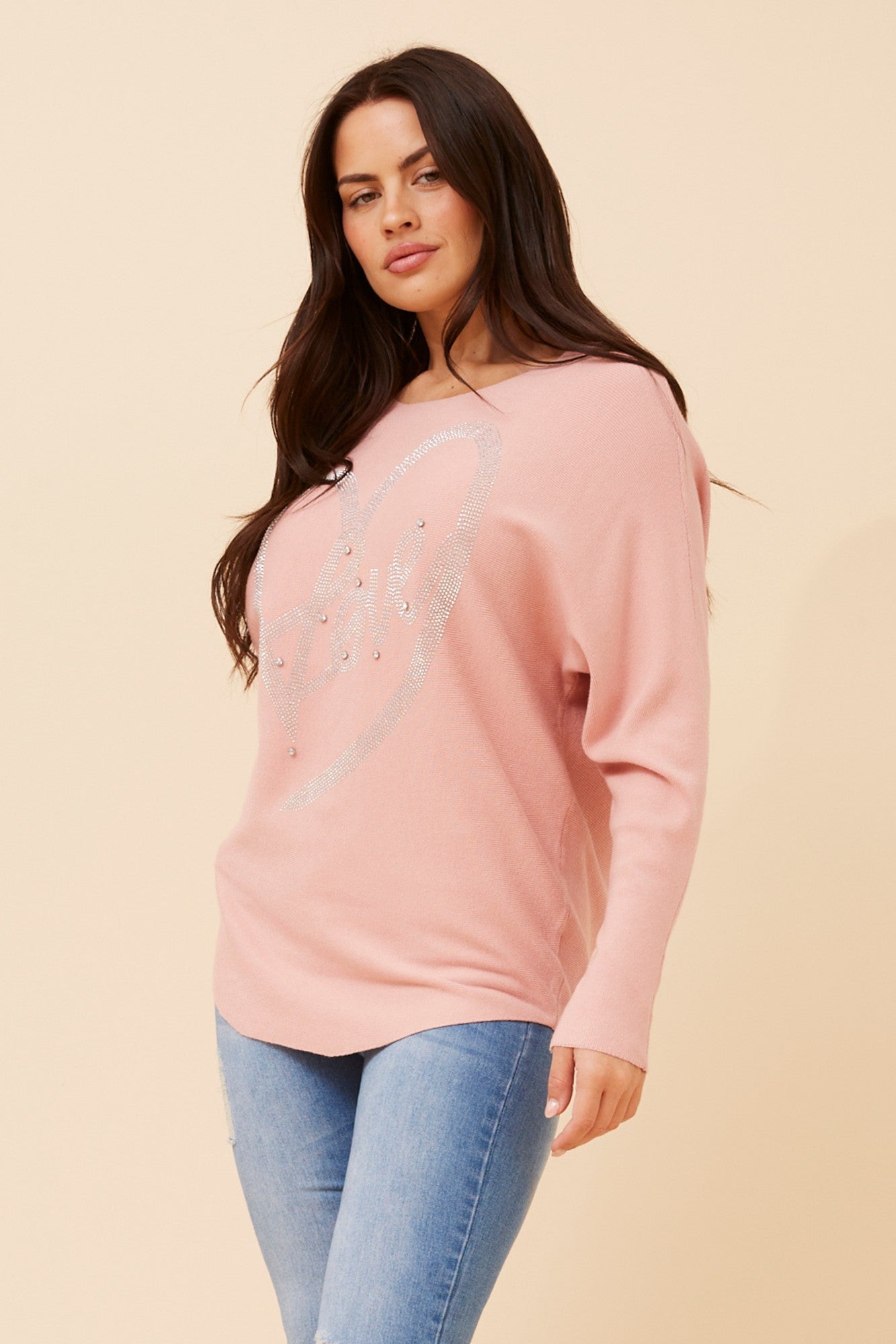 Image of a model wearing Outerwear. Product name - ASTI EMBELLISHED KNIT PULLOVER in Greymarl colour by brand - Caroline Morgan Australia