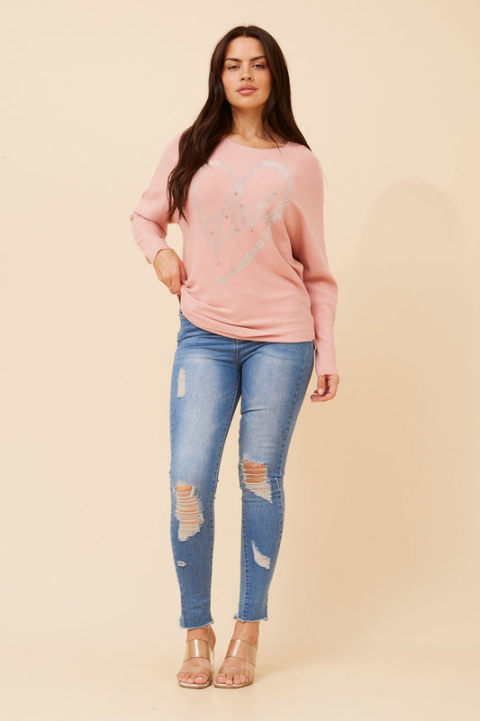 Image of a model wearing Outerwear. Product name - ASTI EMBELLISHED KNIT PULLOVER in Pink colour by brand - Caroline Morgan Australia