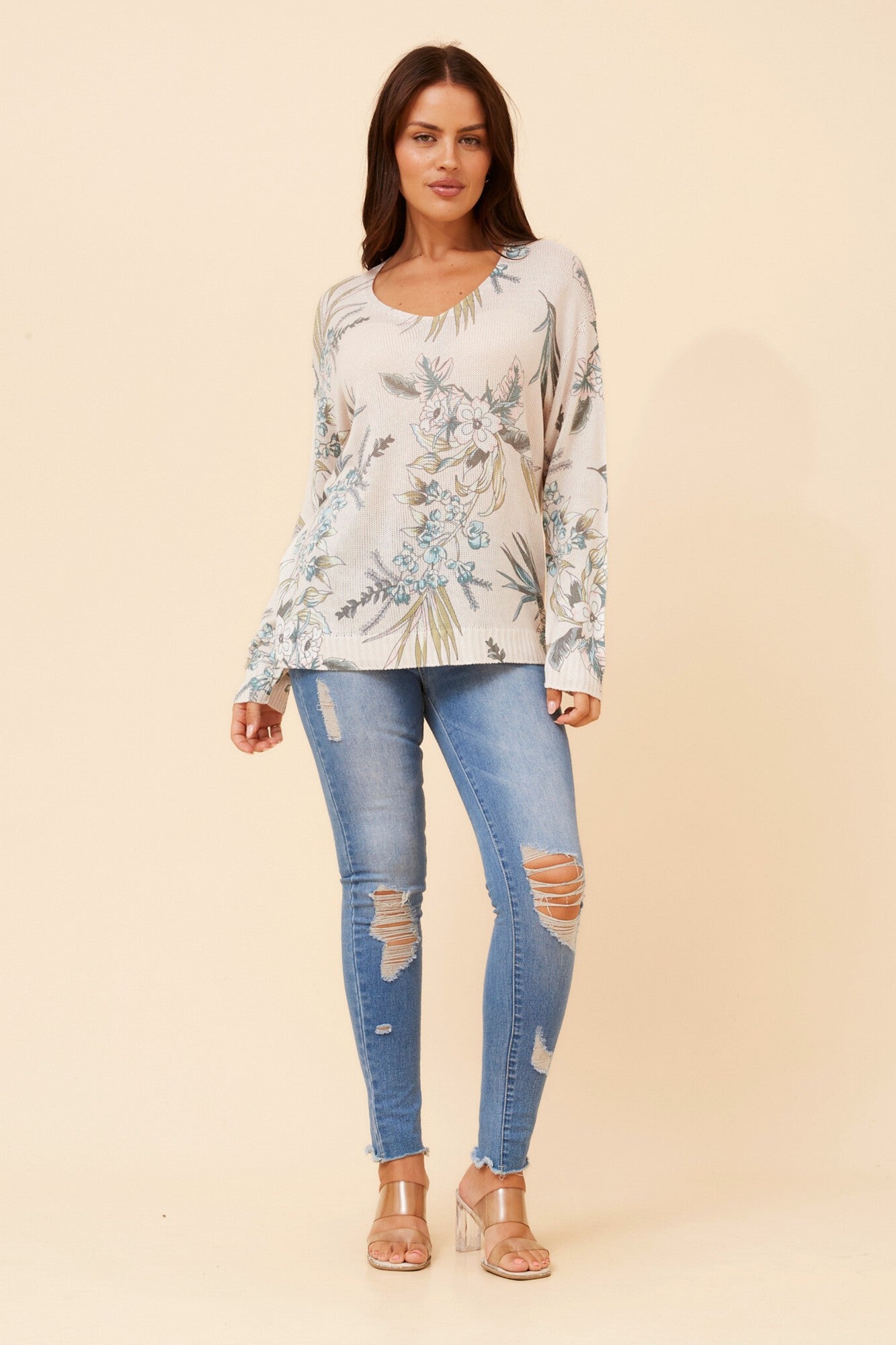 Image of a model wearing Outerwear. Product name - NEAVE FLORAL PRINT KNIT PULLOVER in Latte colour by brand - BOTTEGA MODA