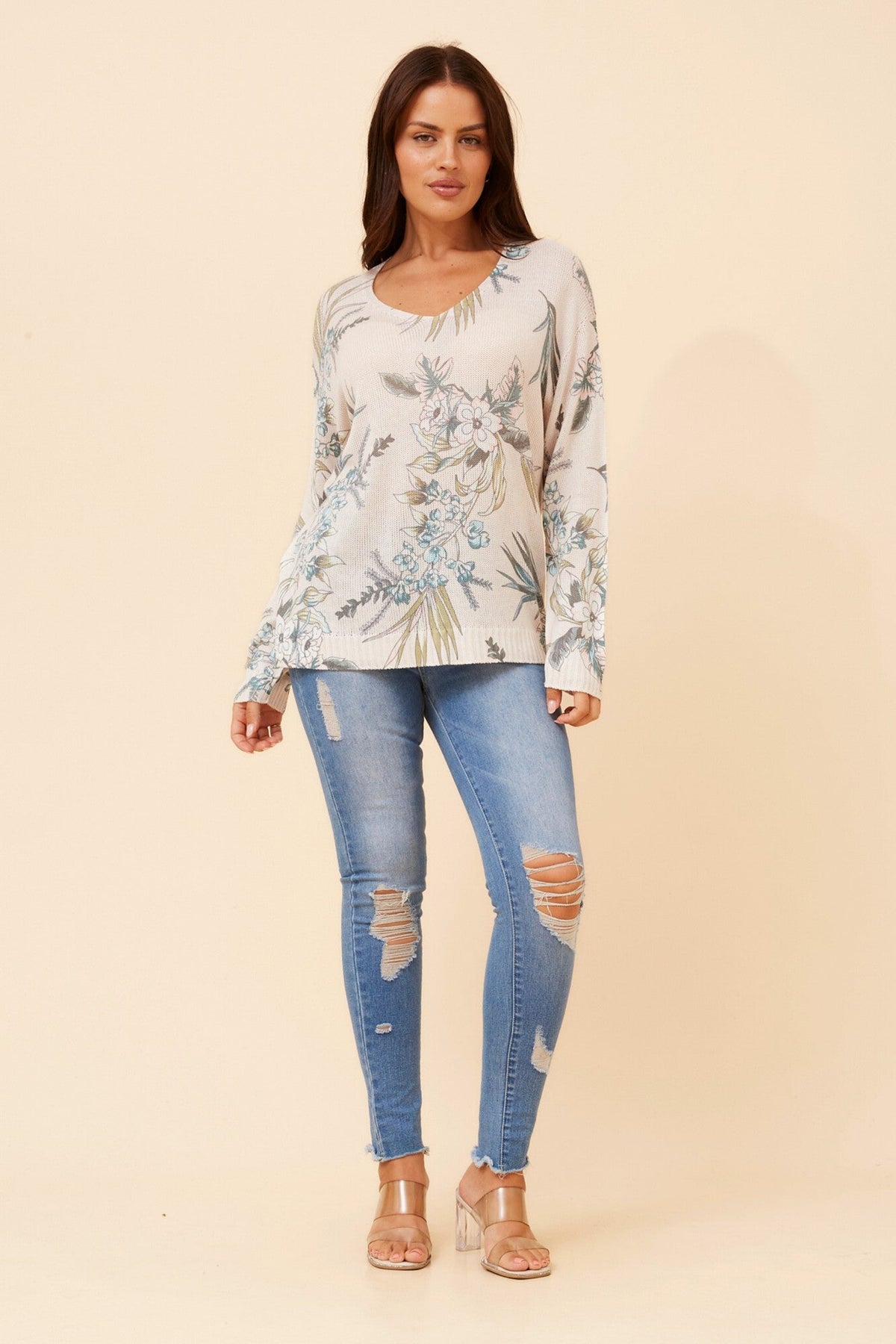 Image of a model wearing Outerwear. Product name - NEAVE FLORAL PRINT KNIT PULLOVER in Latte colour by brand - BOTTEGA MODA