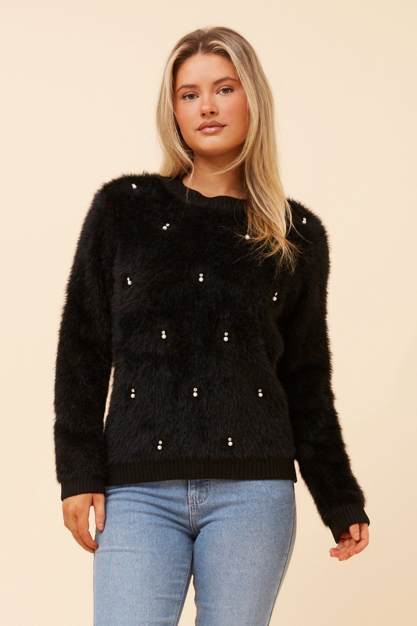 Image of a model wearing Outerwear. Product name - CALEN EYELASH KNIT PULLOVER in Black colour by brand - Caroline Morgan Australia